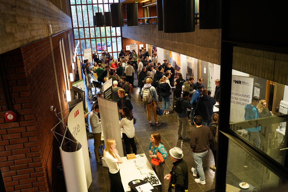 Foyer full of people and stands