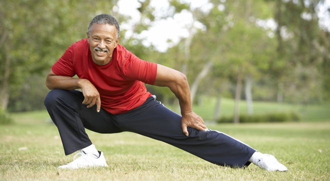 Man excercising on a lawn outdoors