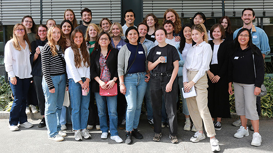 A group of young people standing together and smiling on their first day of studies at the University of Oslo