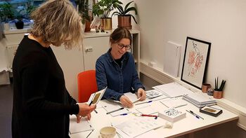 Centre Director Anne Danielsen and Head of Administration Anne Cathrine Wesnes prepare Christmas gift cards and greetings.